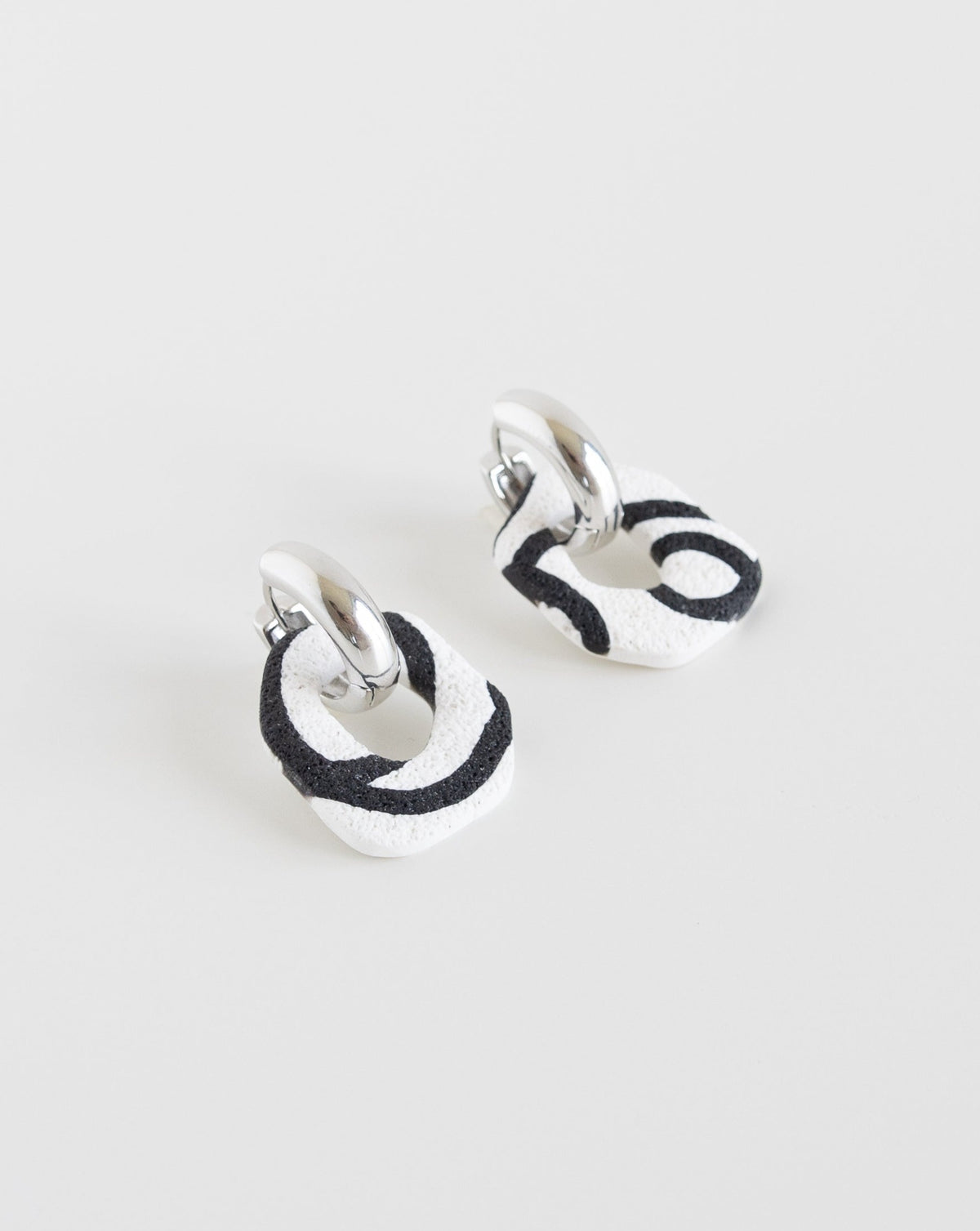 Darien earrings in Abstract White color with silver hoops, side view