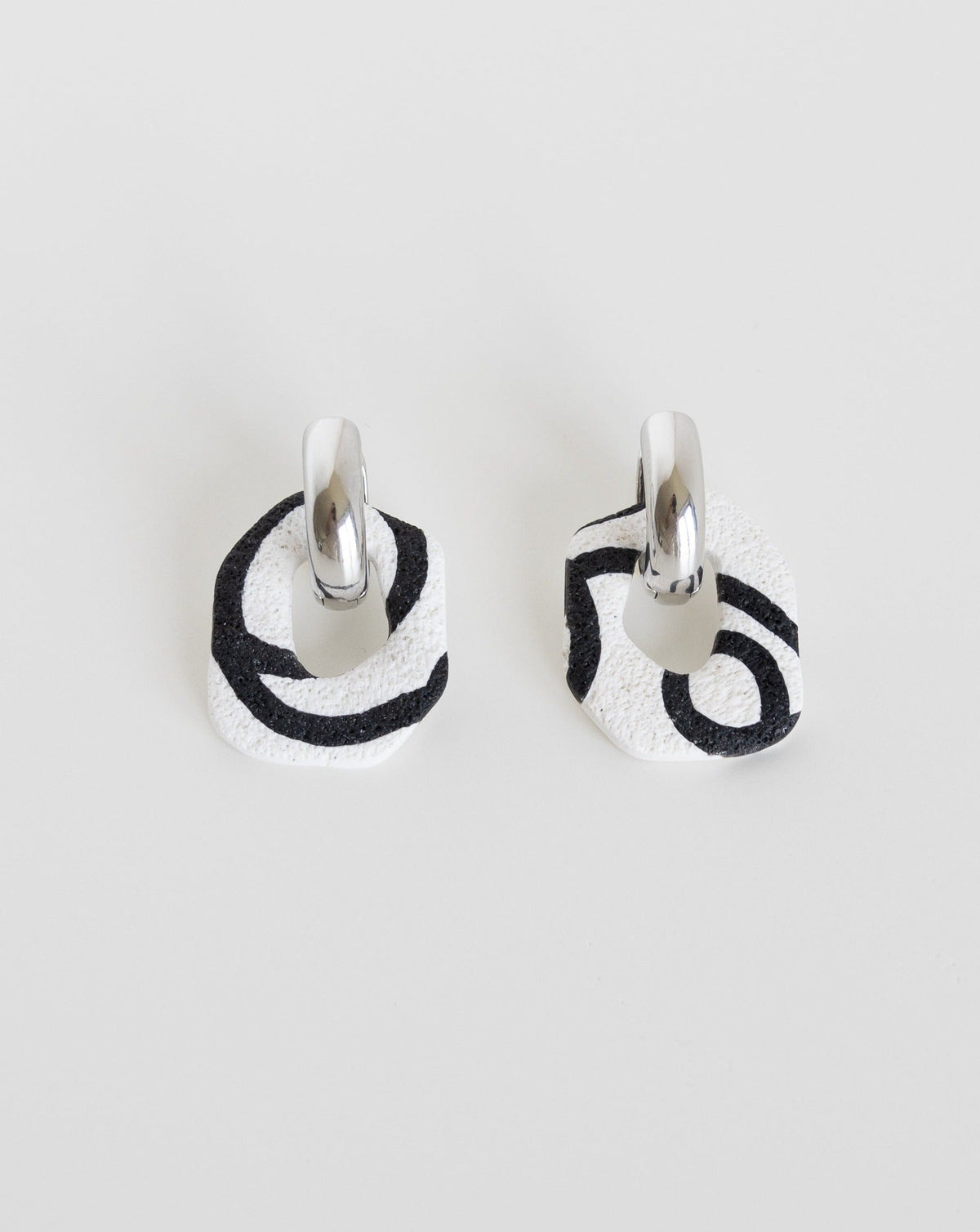 Darien earrings in Abstract White color with silver hoops, front view