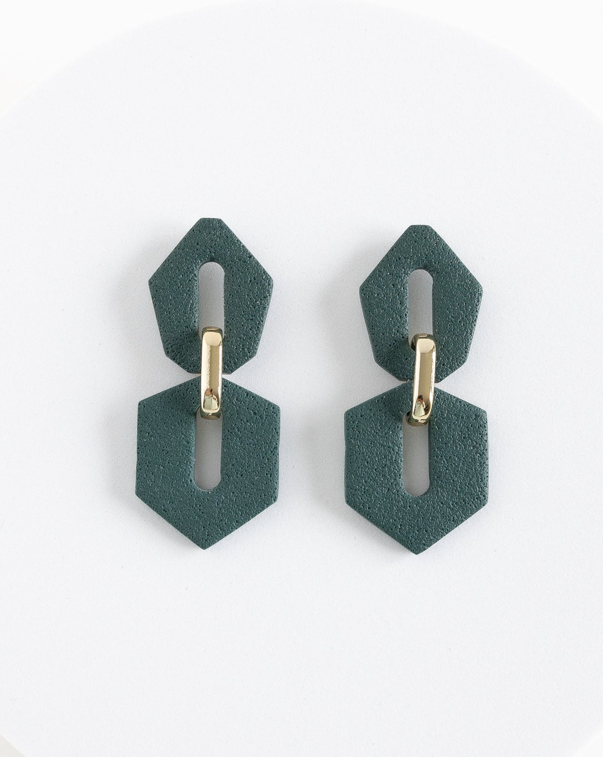 Front view of Shilla earrings in Pine color.