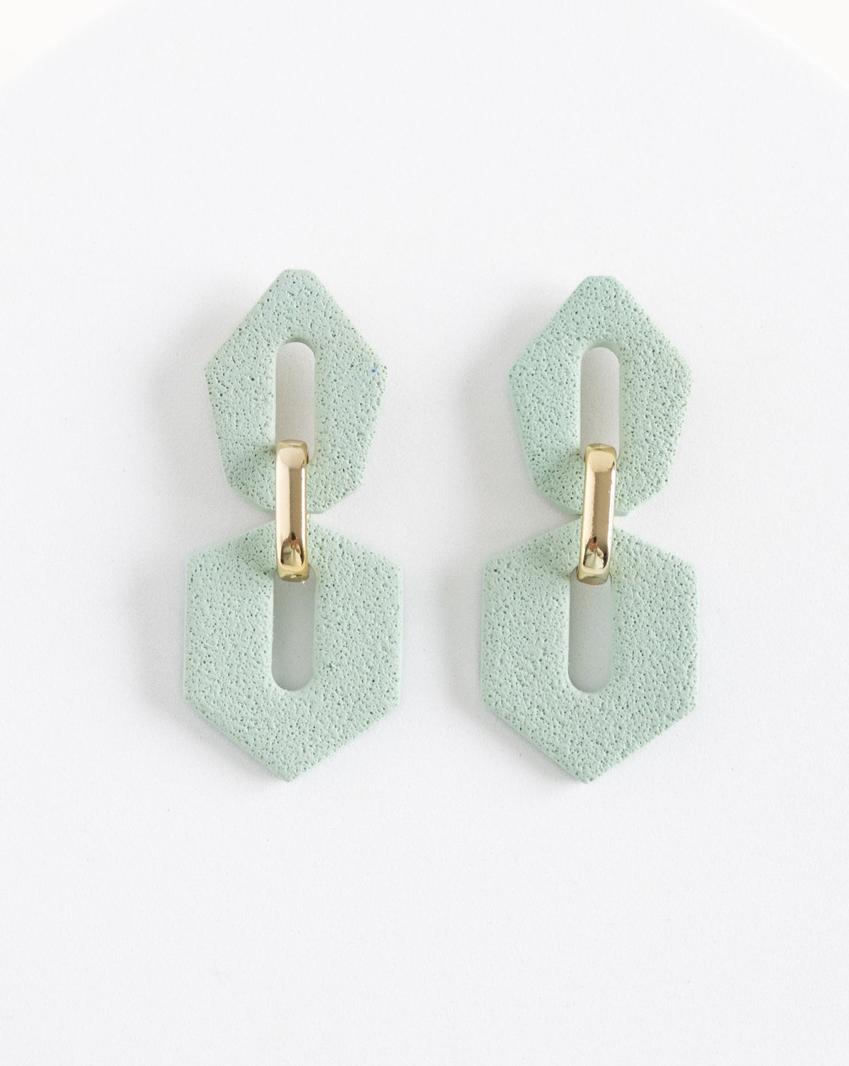 Front view of Shilla earrings in Sage color.