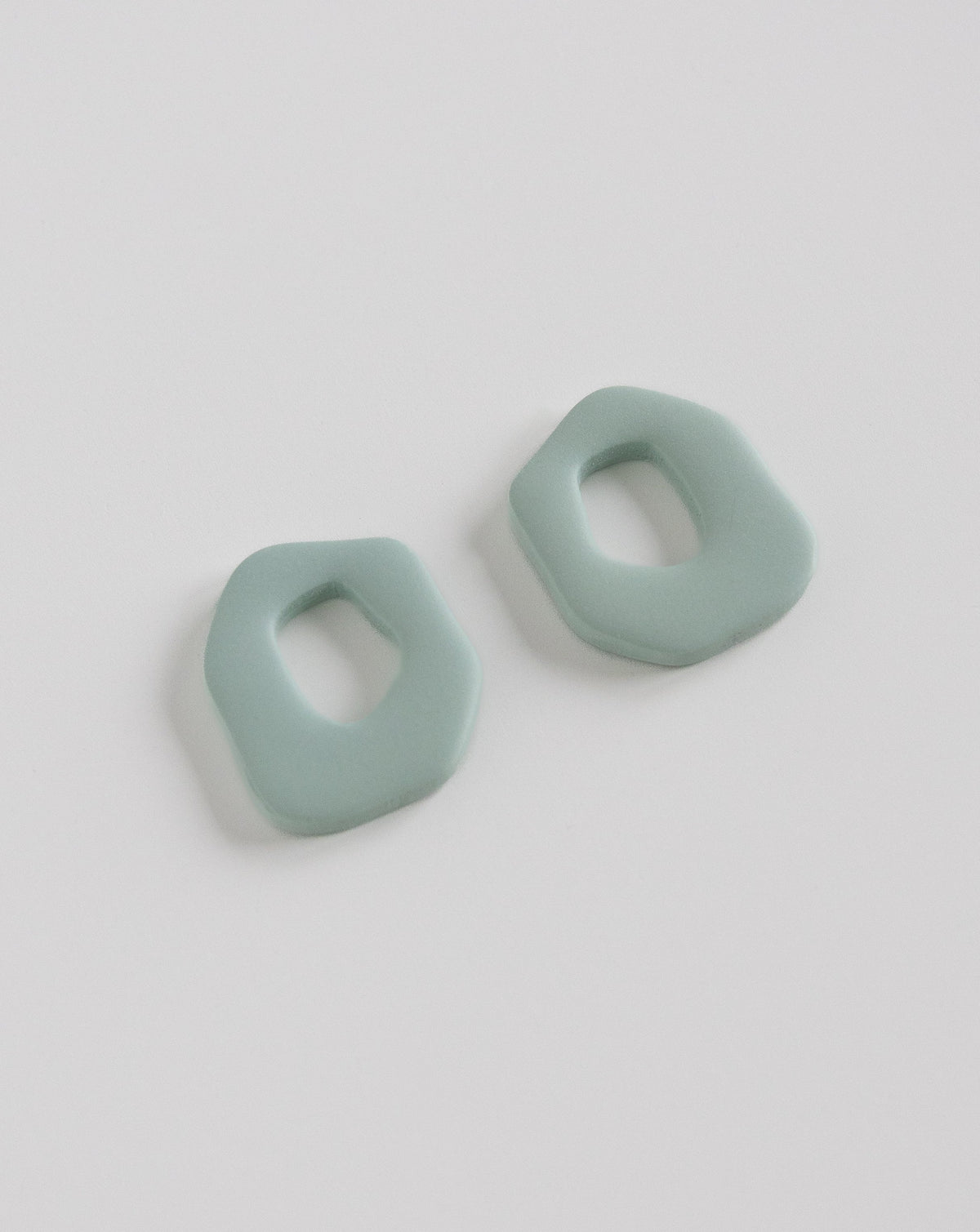 Close up of Darien Beads in Sage color, angled view