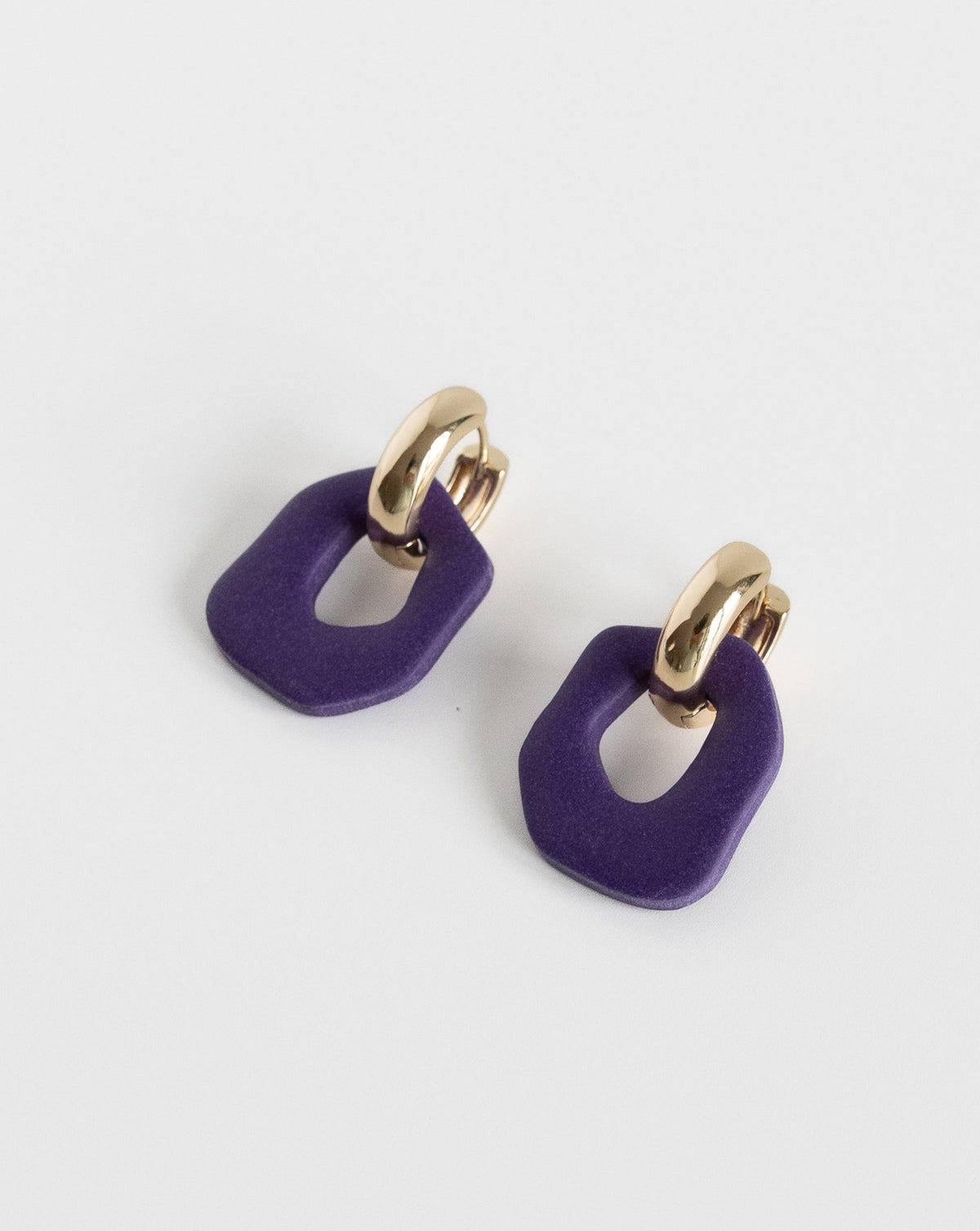 Darien earrings in Purple color with gold hoops, side view