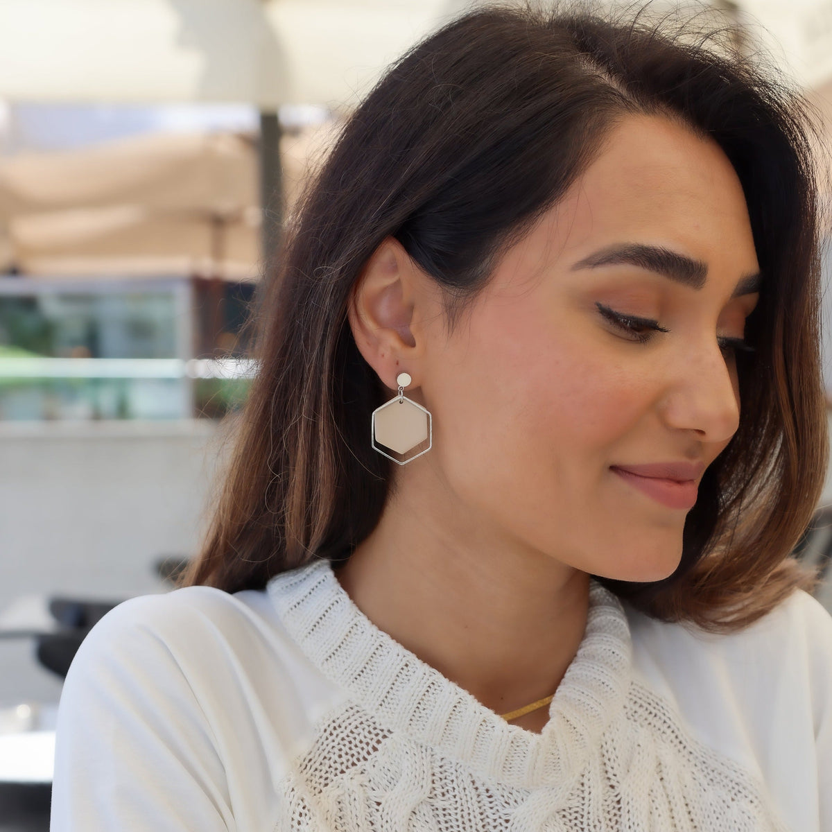 Aisha earrings gold jewelry white on model