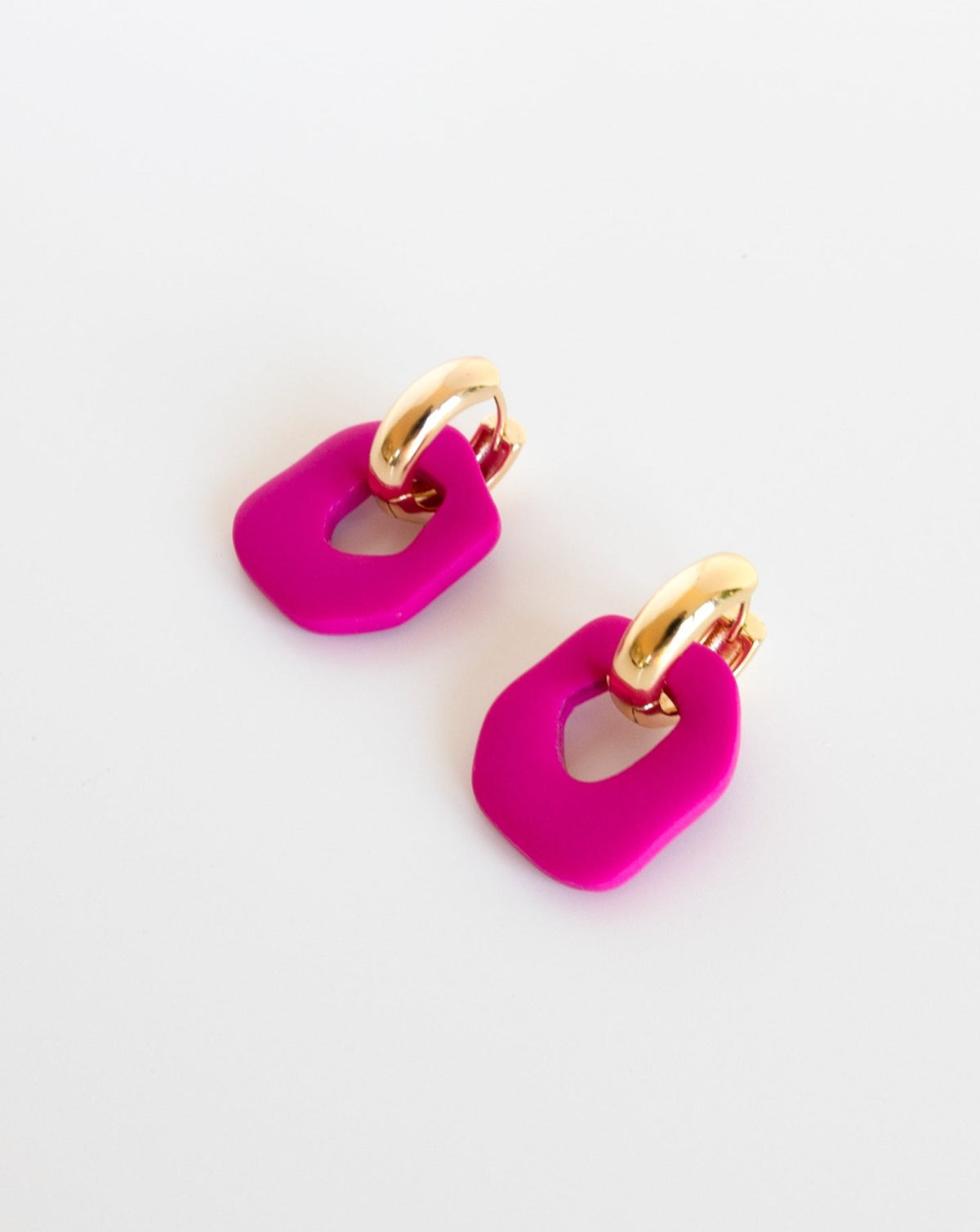 Darien earrings in Fuchsia color with gold hoops, side view