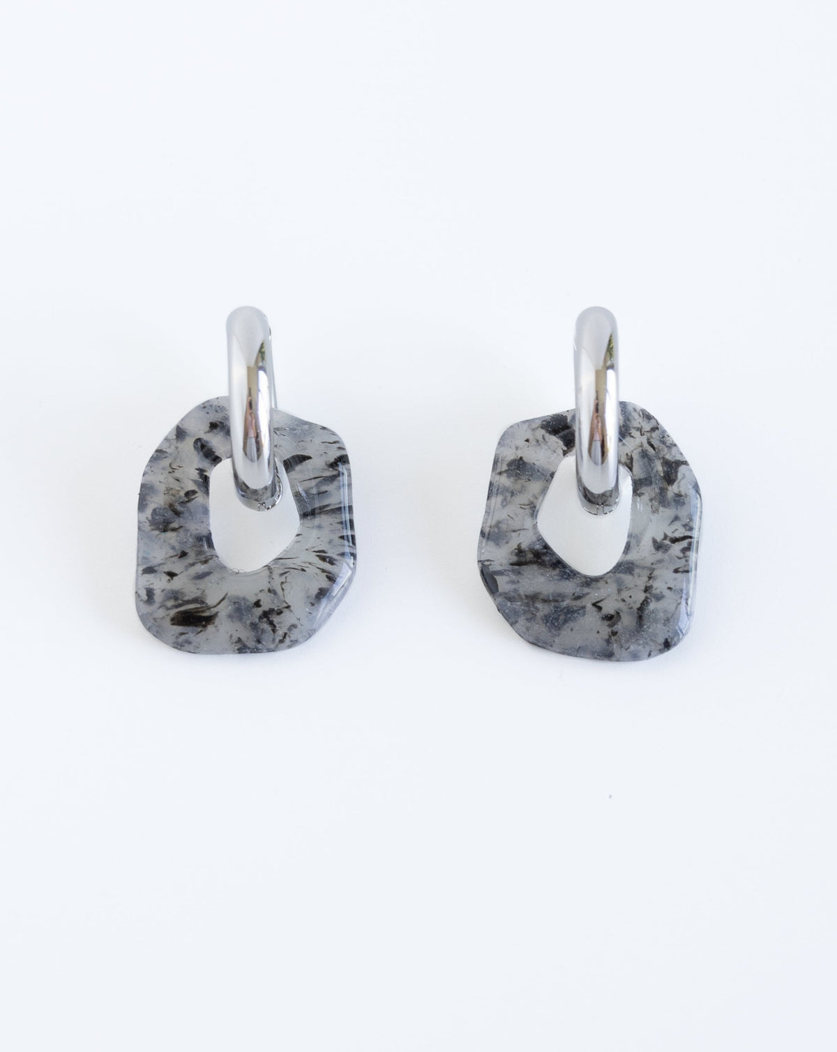 Darien earrings in black Marble pattern with silver hoops, front view