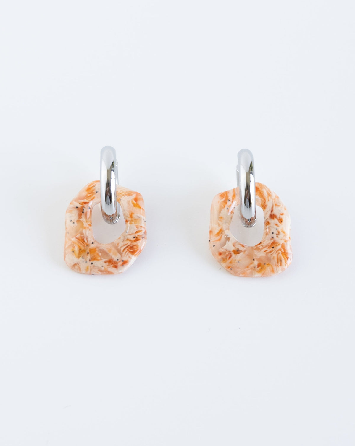 Darien earrings in Marble orange pattern with silver hoops, front view