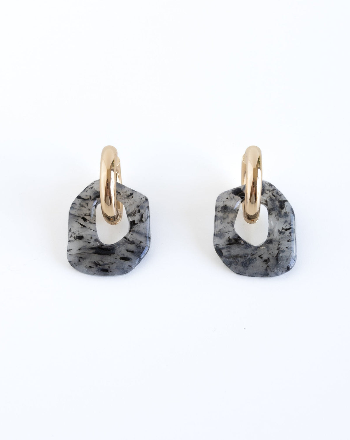 Darien earrings in black Marble pattern with gold hoops, front view
