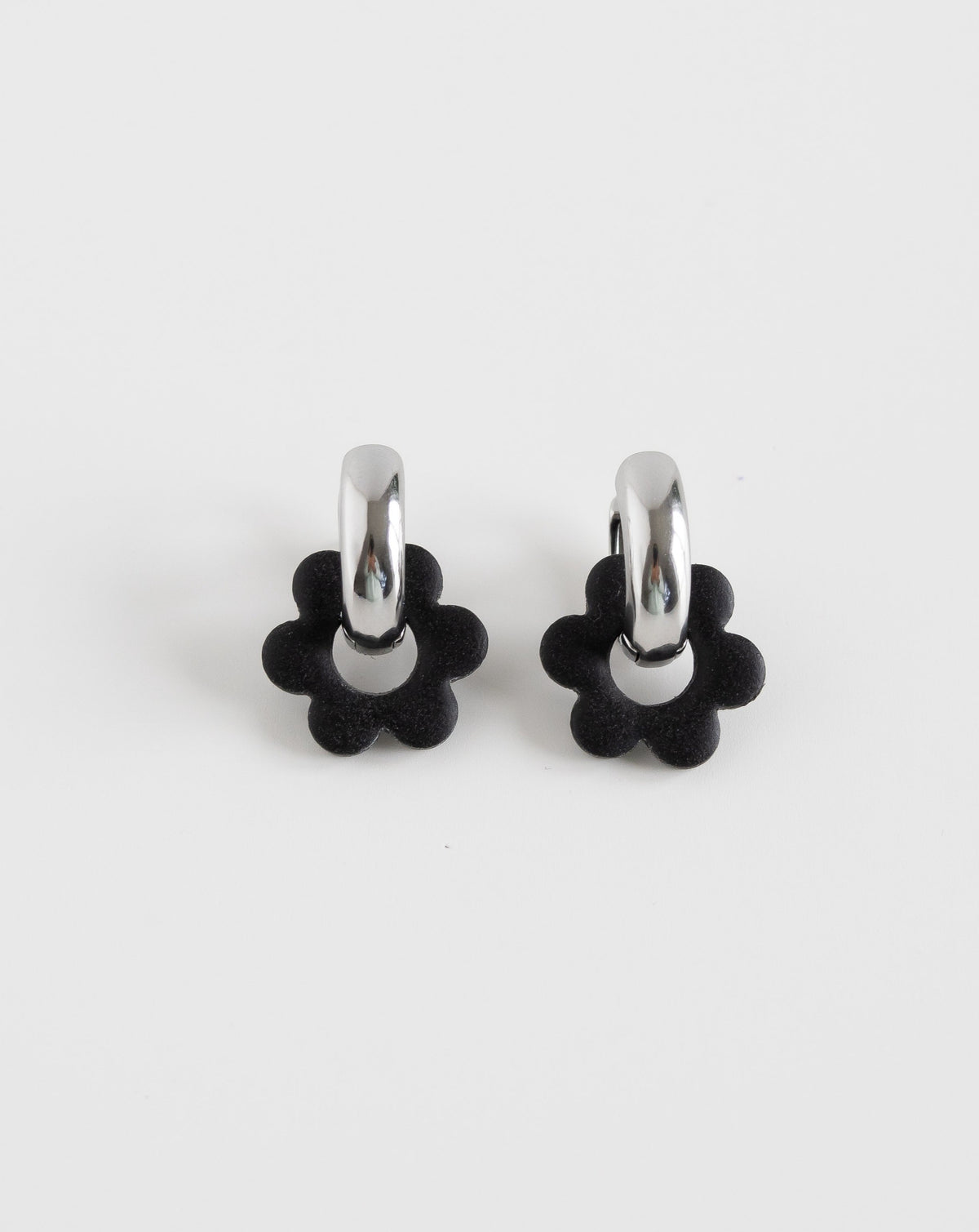 black color Goli Bold earrings in silver hoops