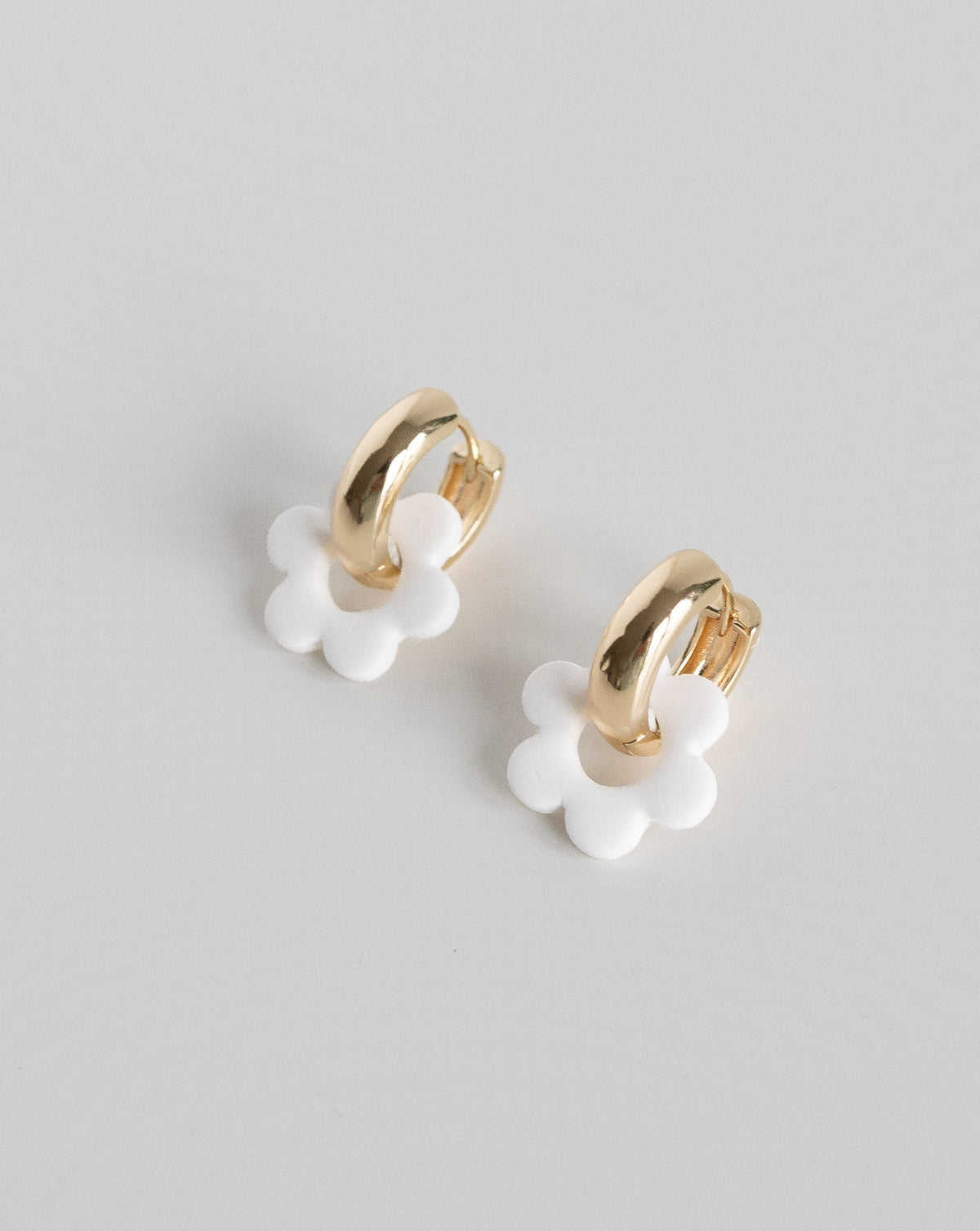 white color  Goli Bold earrings in gold hoops