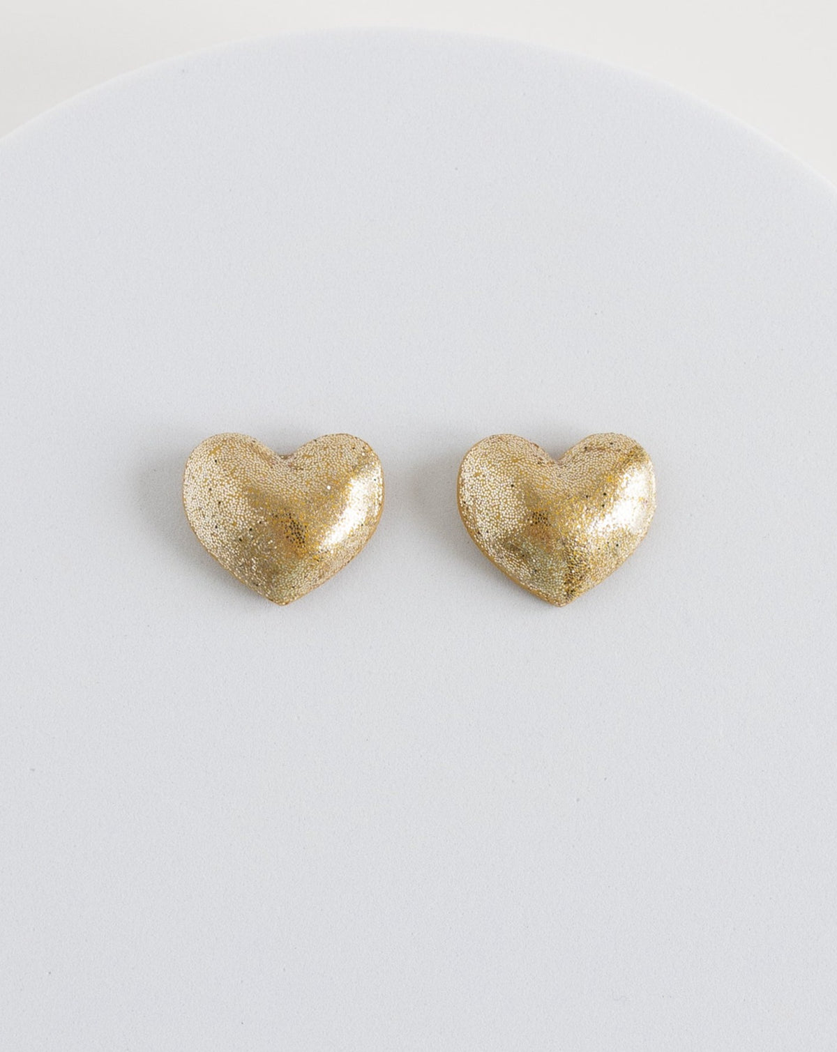 Gold heart stud earrings on display, 3 cm length, Hand crafted in the Netherlands by LYHO.