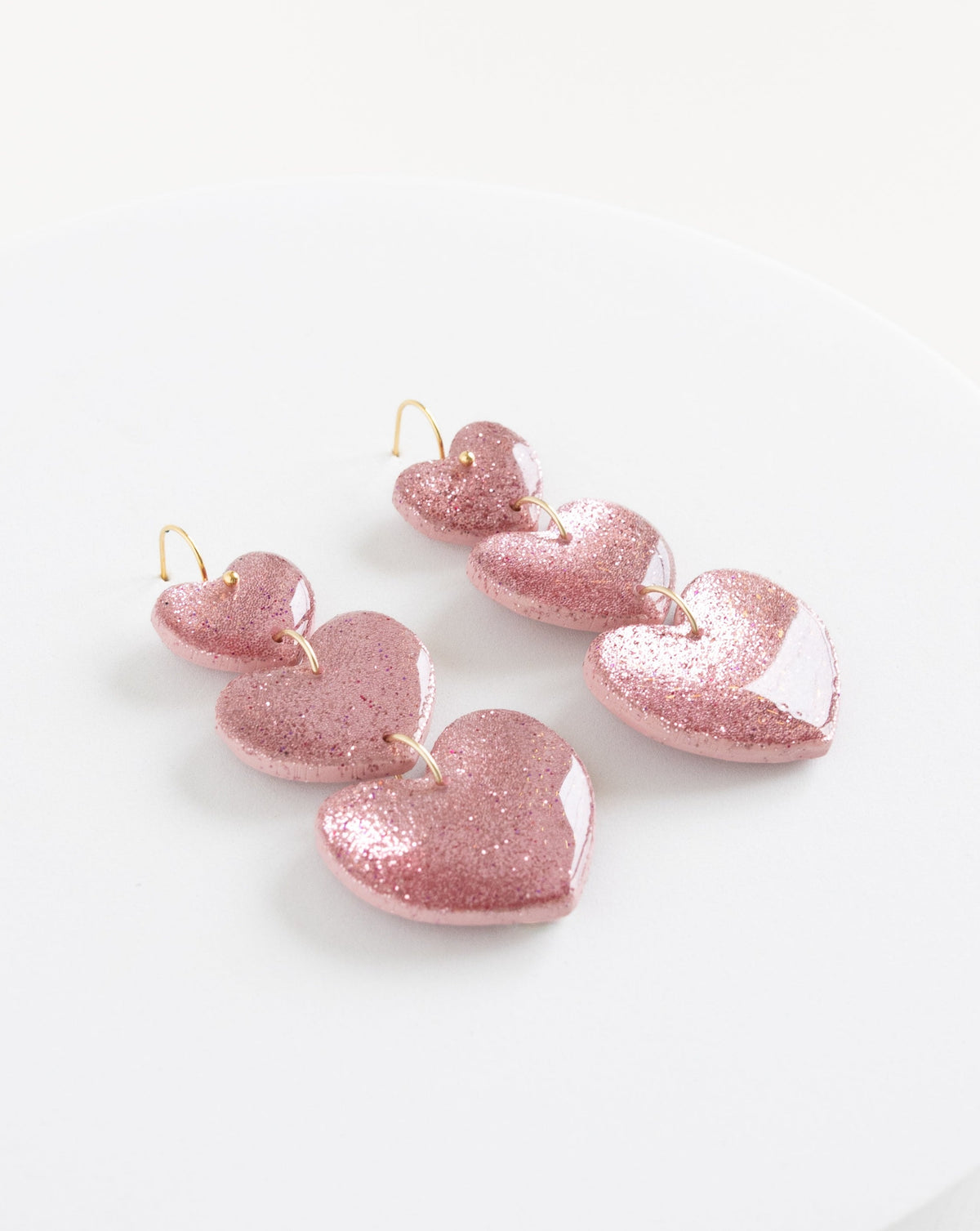 angled view of the Leyli earrings in color pink.