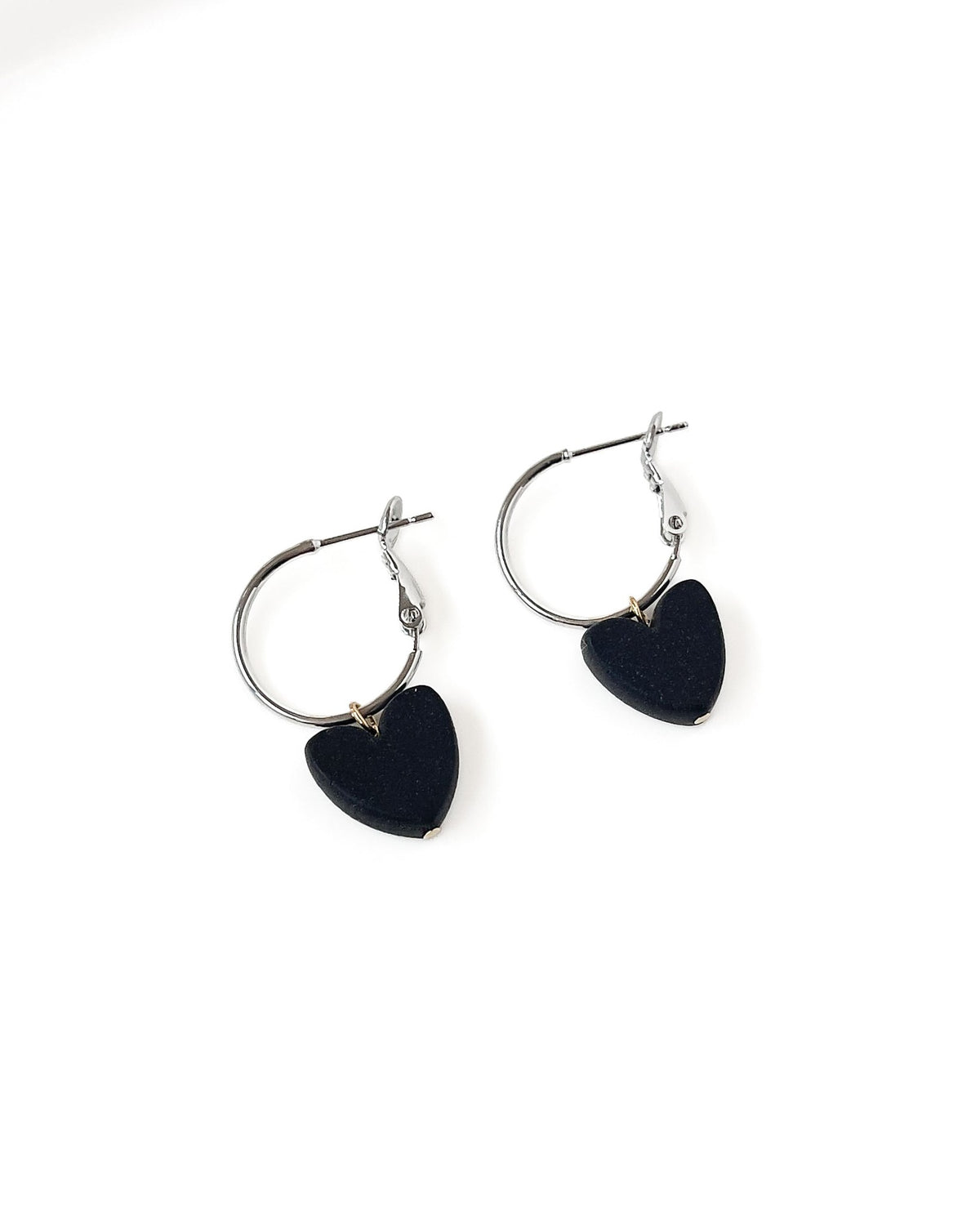 Charming Heart earrings with silver regular Hoops and black Heart charm.