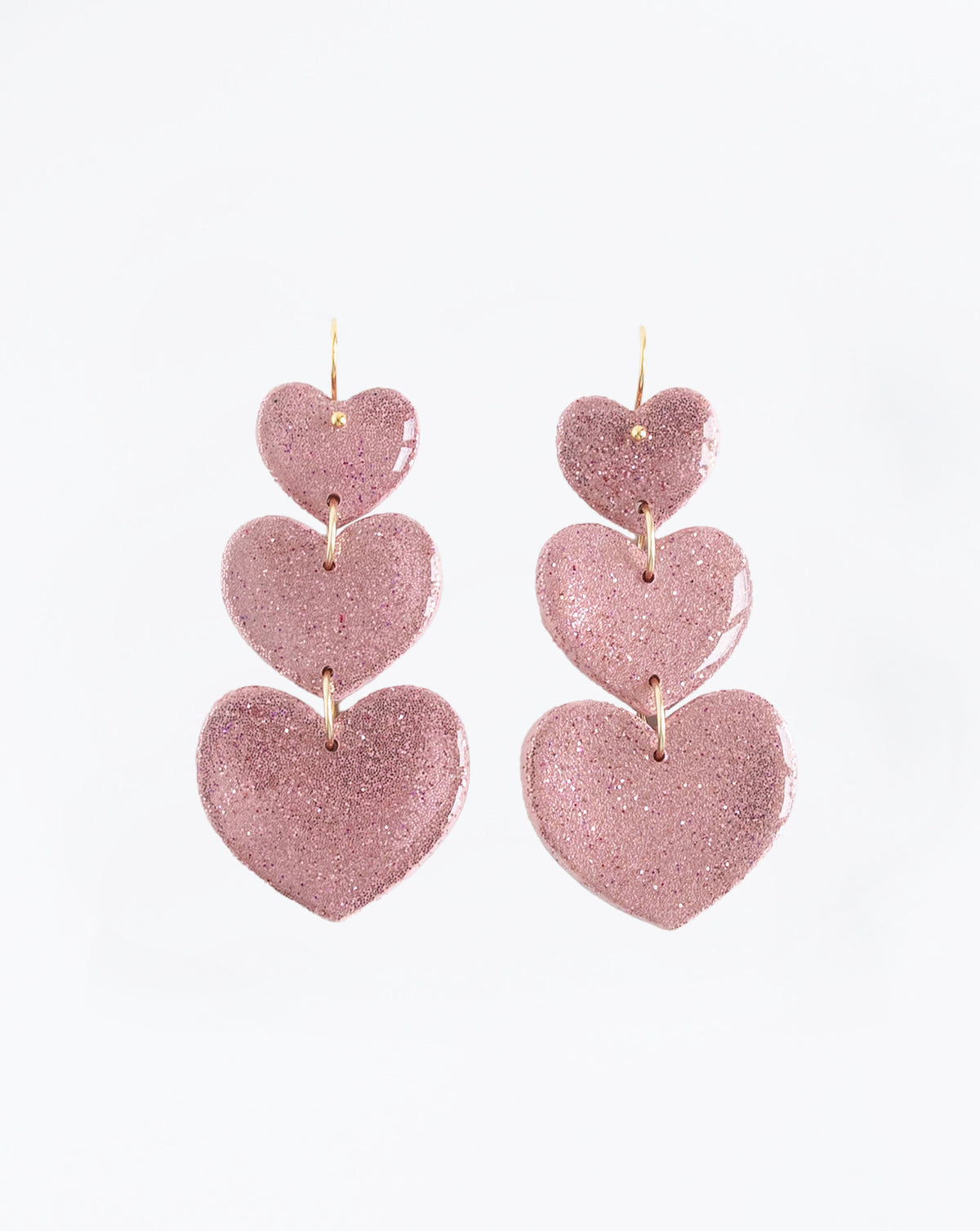 Leyli earrings in color pink, sparkle and shine of resin coated Polymer clay.handmade in LYHO studio in the Netherlands. 