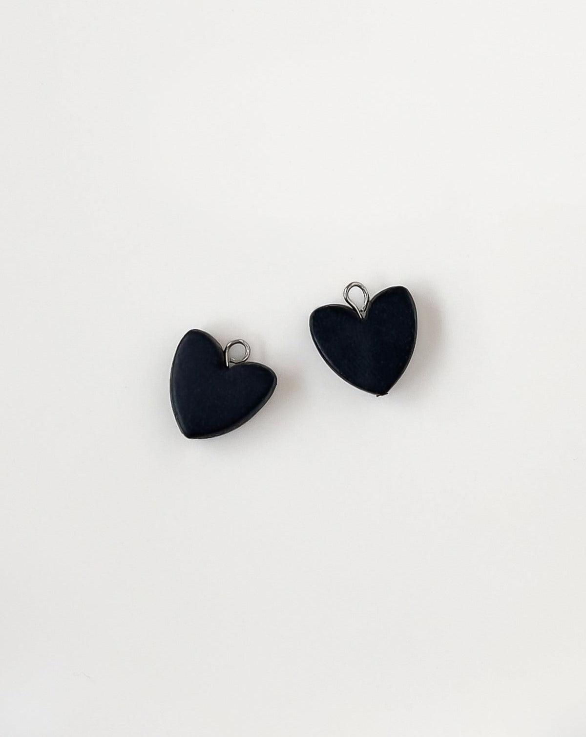 heart charms in color black.