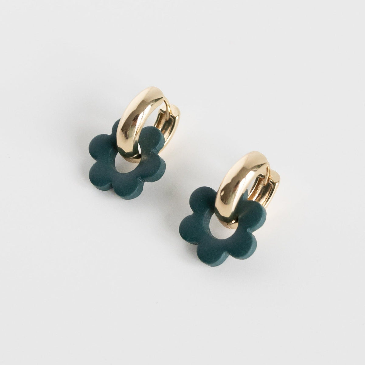 Goli Bold earrings in pine color with thick gold plated hoops.