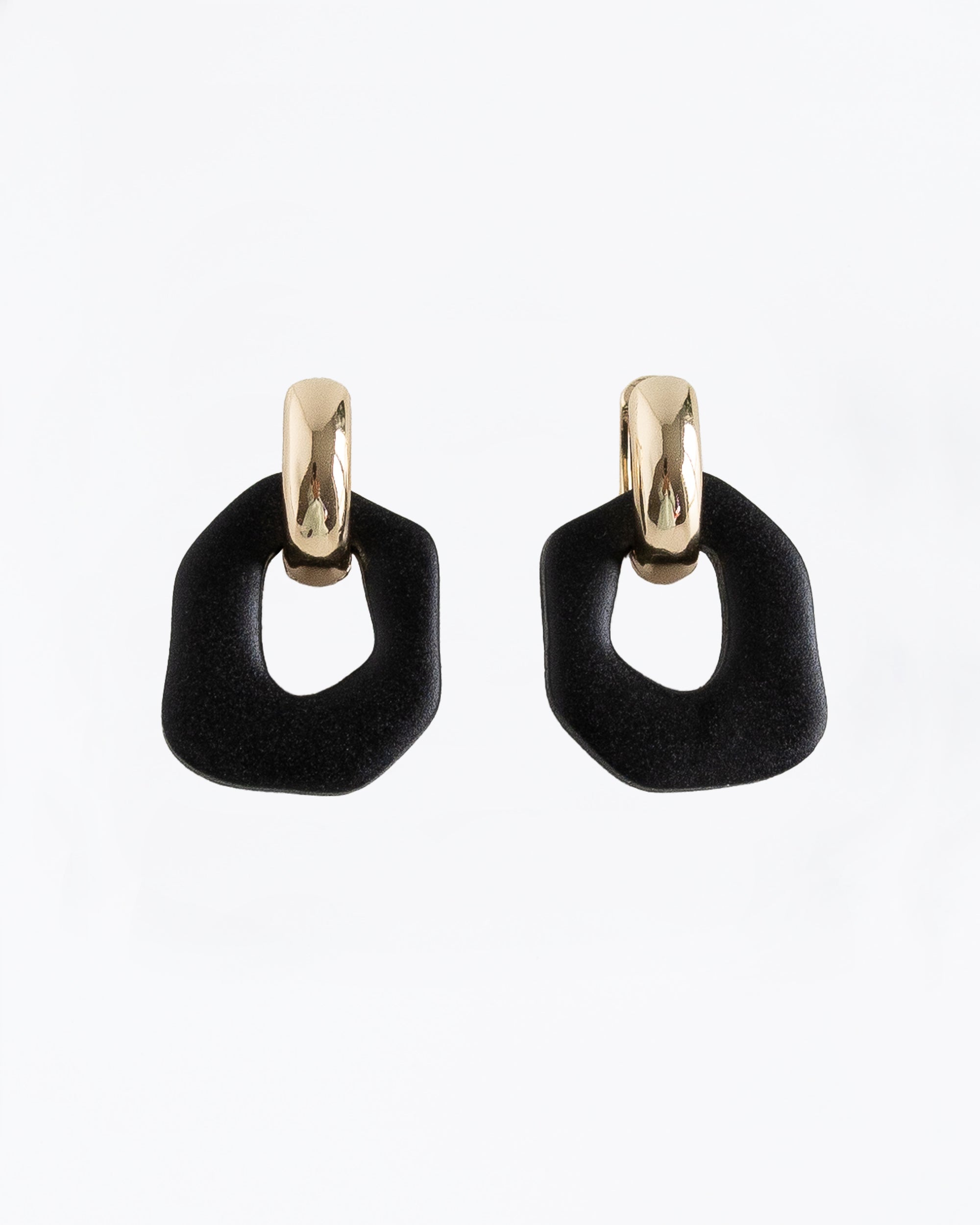 Close-up of Darien earrings in Black with gold hoops